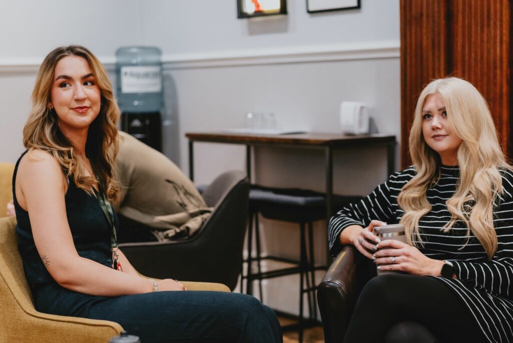 MacMartin's Graphic Designer (Right) and Copywriter (Left) discussing branding project