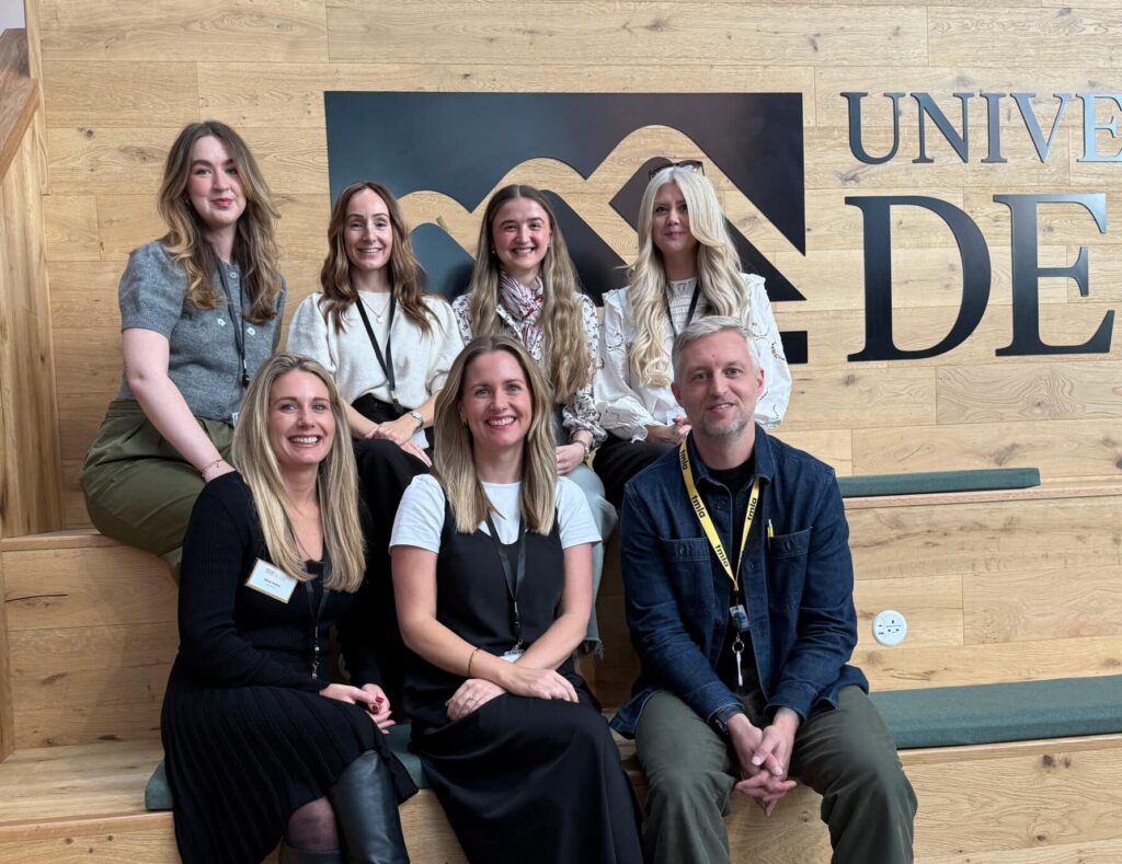 The MacMartin team sat together in their new home - the University of Derby's new Business School