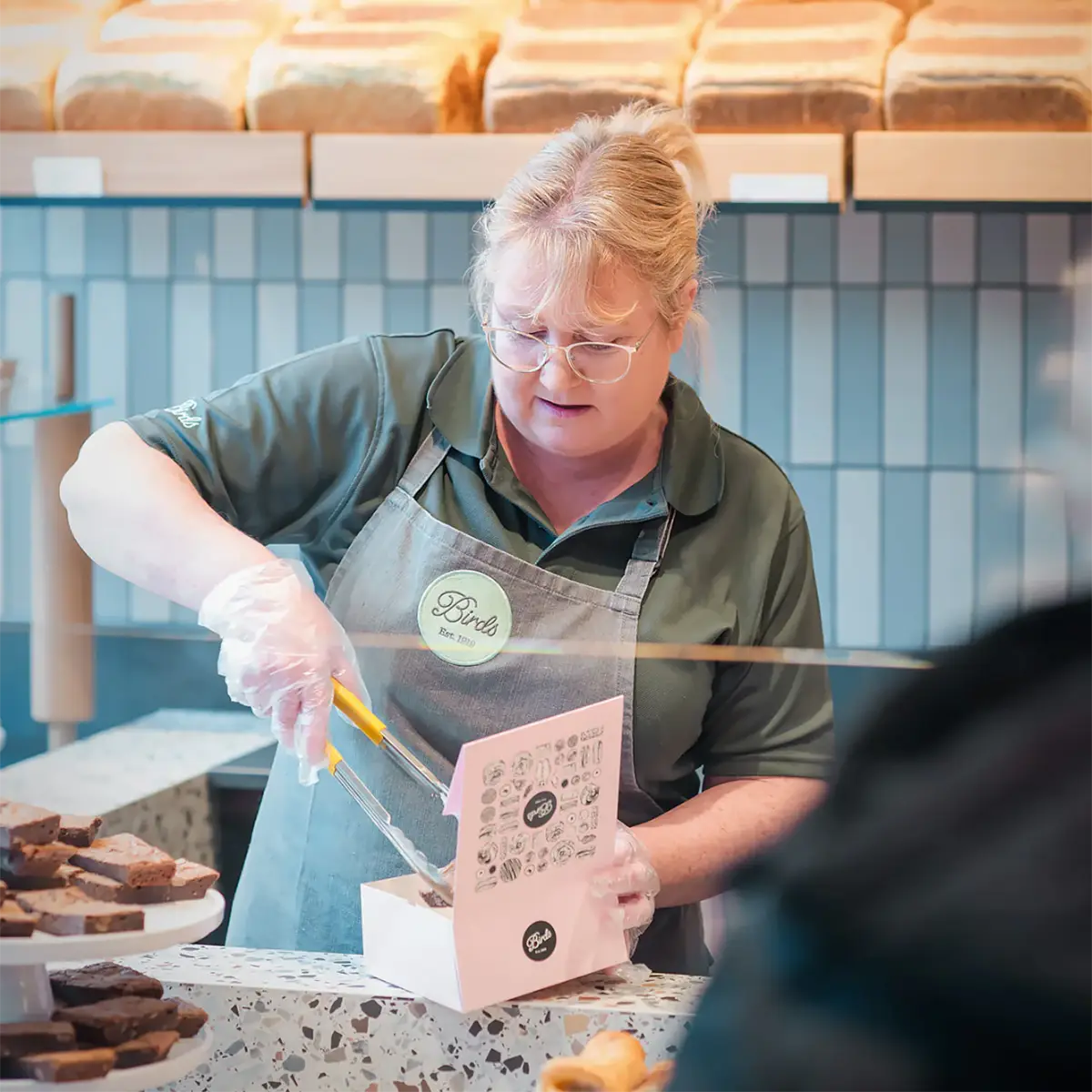 Birds Worker Serving in Store